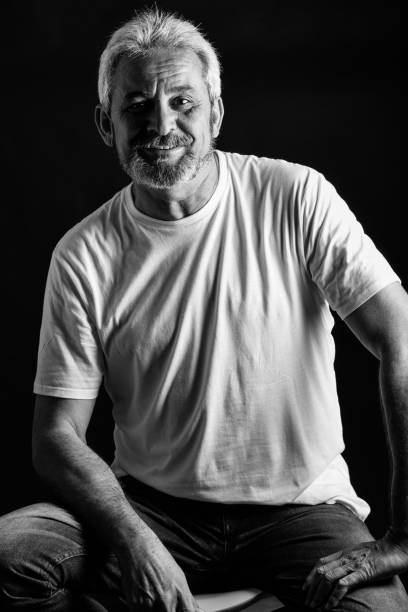 istock Mature man with white hair and beard smiling 874293954