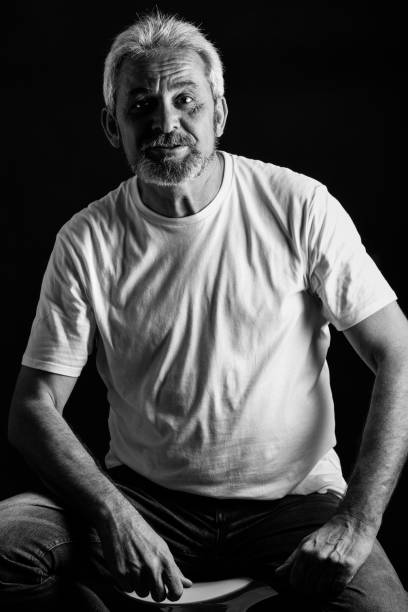 istock Mature man with white hair and beard smiling 874294072