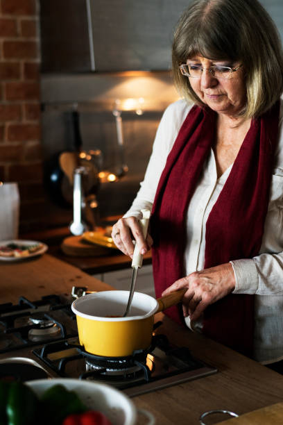 istock A Caucasian woman cooking for Christmas dinner 874294564