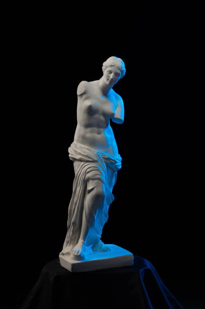 istock Statue of Venus in blue light on a black background 874294646