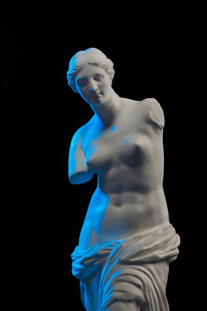 istock Statue of Venus in blue light on a black background 874294748