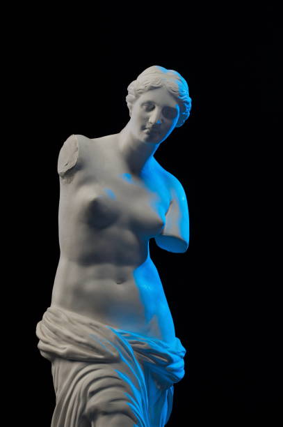 istock Statue of Venus in blue light on a black background 874294840