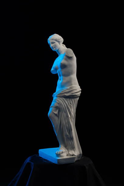 istock Statue of Venus in blue light on a black background 874294944