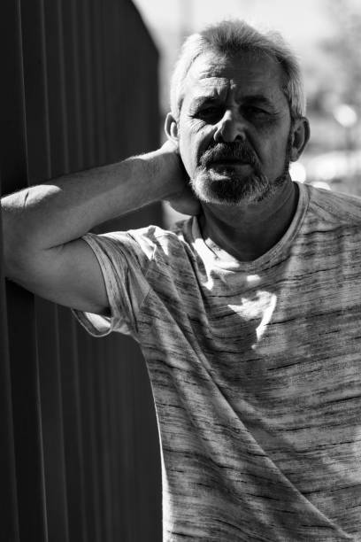 istock Mature man with white hair in urban background 874297924