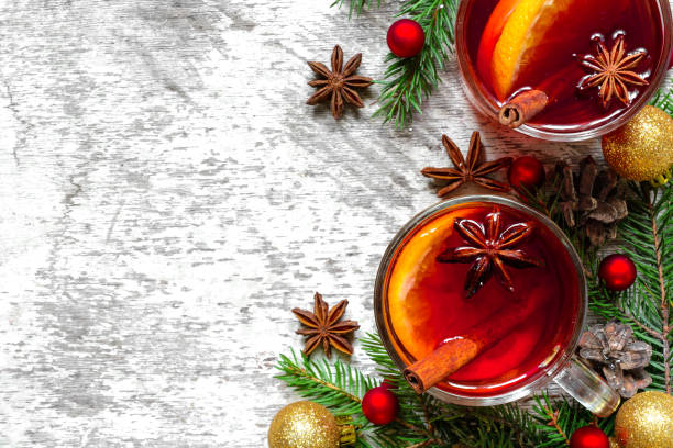 istock glasses of mulled wine with cinnamon, anise and fir tree branches with decorations 874301100