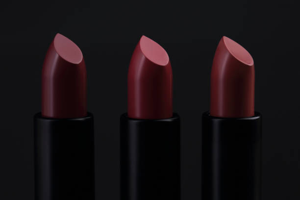 istock Lipsticks isolated on black. Closeup 874301722
