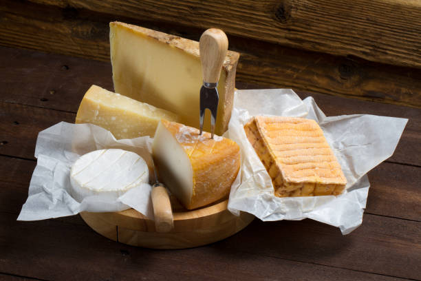 istock Various types of cheeses on a wooden table 874302108