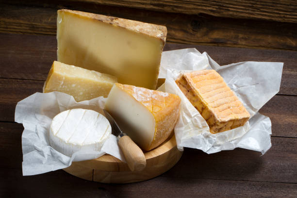 istock Various types of cheeses on a wooden table 874302166