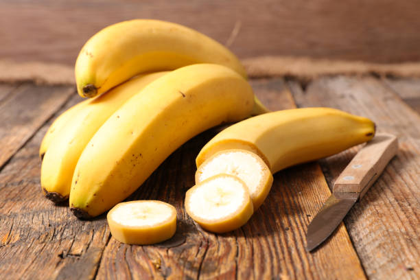 istock banana on wood background 874306084
