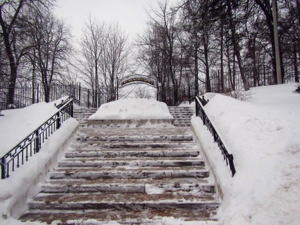 istock Winter park stairs in small Russian town 874306226