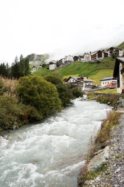 istock Stream and Glacier from Alps highest and most extensive mountain range flowing passed at Villages 874312722