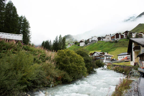 istock Stream and Glacier from Alps highest and most extensive mountain range flowing passed at Villages 874312746