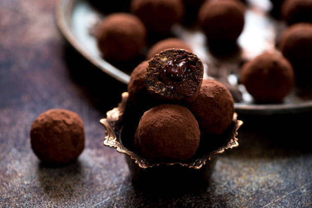 istock Chocolate candies truffles with chocolate cream 874314562