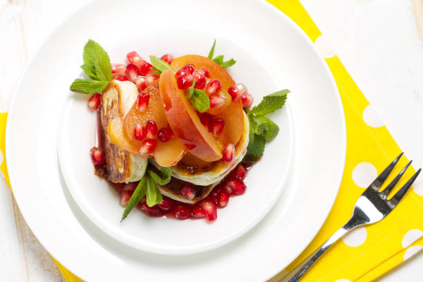 istock Cottage cheese and vanilla pancakes with apple compote, pomegranate grenadine and mint 874316838