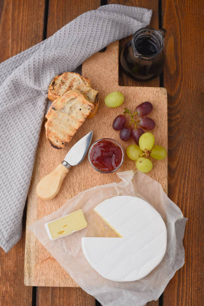 istock Camembert with grapes and wine, cheese platter 874320494