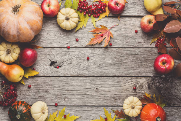 istock Autumn background with yellow leaves and pumpkins 874321782