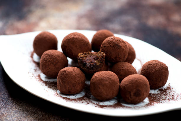 istock Chocolate candies truffles with chocolate cream close-up 874321966