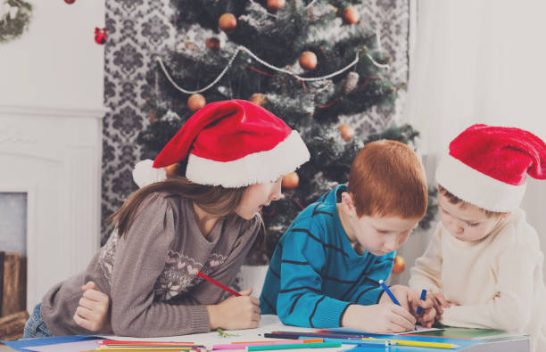 istock Children writing letter to santa, wait for christmas 874328122