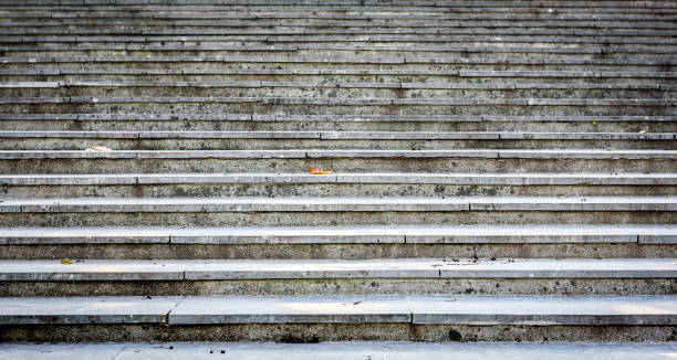 istock Old, majestic, grand, granite stone staircase leading up texture. 874330894