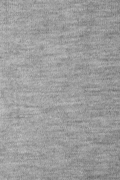 Melange knitted fabric textile pattern Real grey knitted fabric made of heathered yarn textured background heather grey stock pictures, royalty-free photos & images
