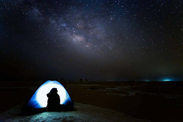 istock A woman silhouette in a tent 874332424