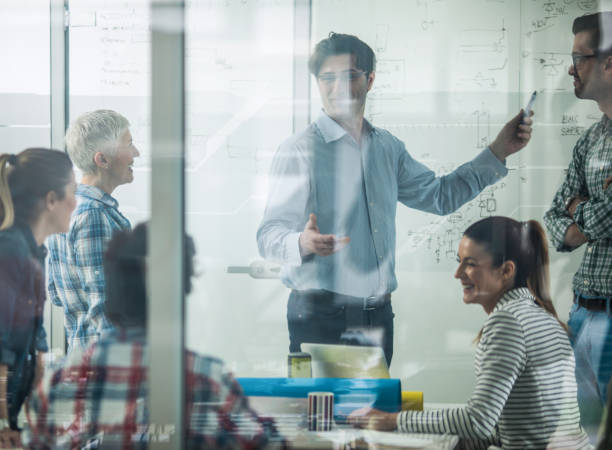 istock Happy creative team talking about new business plans on a meeting. 874333594