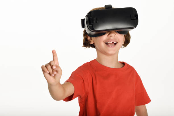 istock Little girl looking in VR glasses and gesturing with his hands. 874333802