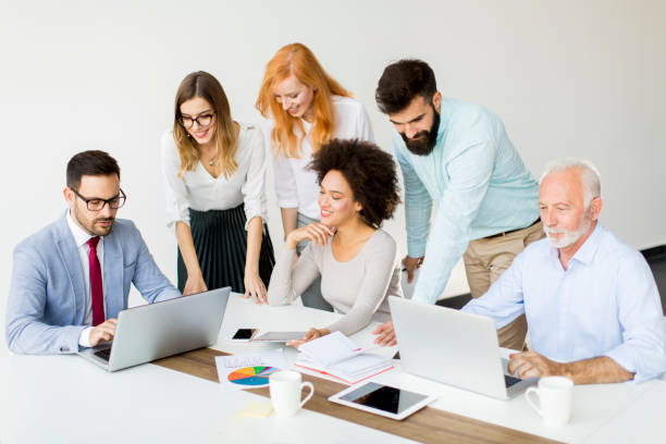 istock Joyful multiracial business team at work in modern office 874343866