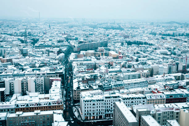 istock Aerial view of snow covered rooftops in Berlin, Germany 874346600