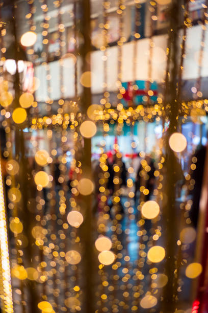 istock Christmas lights with blur bokeh. Night lights on street. Bokeh light abstract background. 874347724
