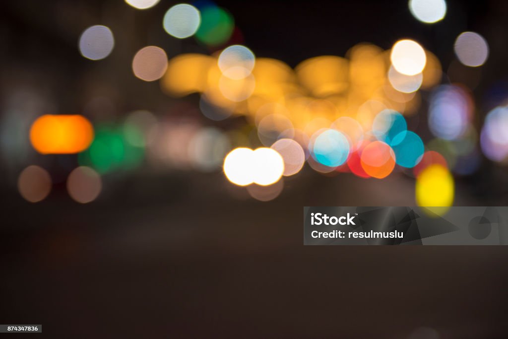 Christmas lights with blur bokeh. Night lights on street. Bokeh light abstract background. Abstract Stock Photo