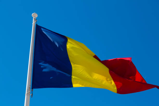 istock Romanian flag is fluttering in the wind 874348214
