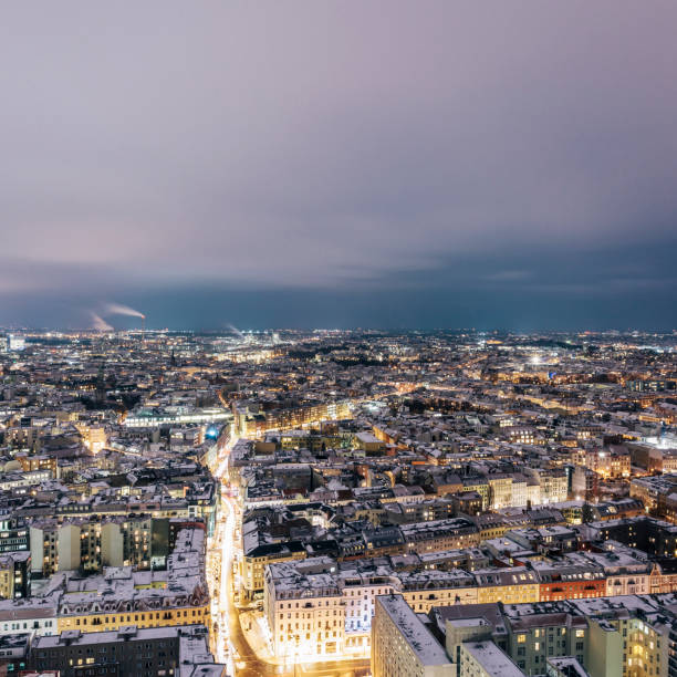 istock Aerial view of snow covered rooftops at night, Berlin, Germany 874348798