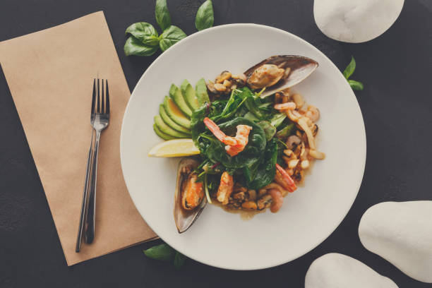 istock Warm salad with grilled seafood flat lay 874351888