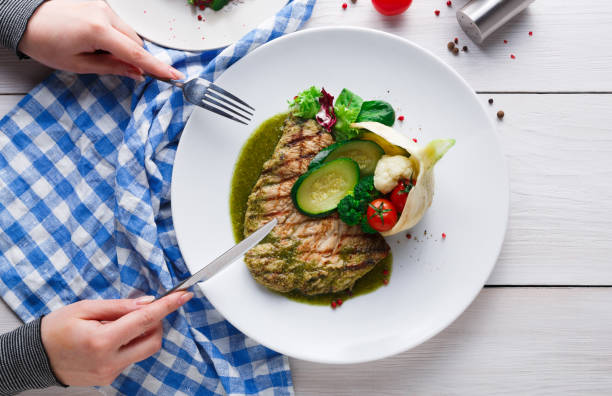 istock Grilled beefsteak with vegetables and green bell pepper sauce 874353510