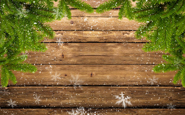 frame of fir branches and snowflakes stock photo