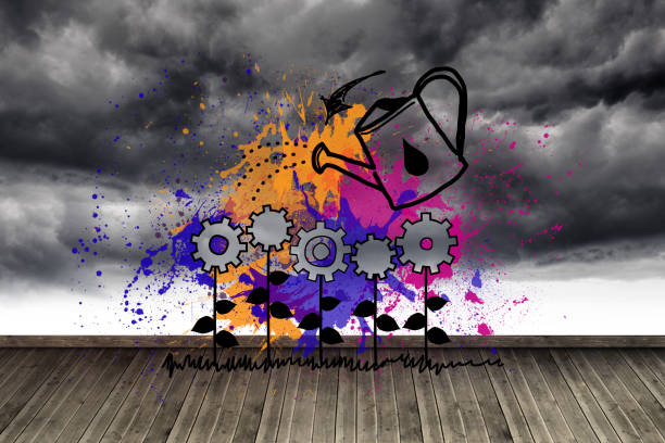 istock Cog flowers with can at wall with stormy sky 874363556