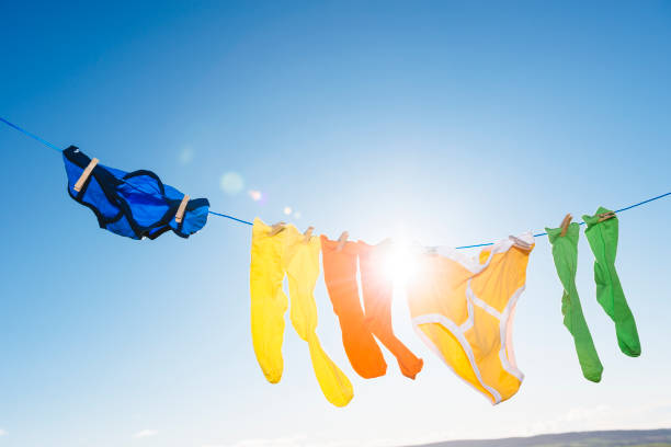 istock Vibrant coloured socks and retro Y-fronts on a washing line. 874369200