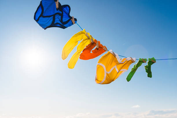 istock Vibrant coloured socks and retro Y-fronts on a washing line. 874369202