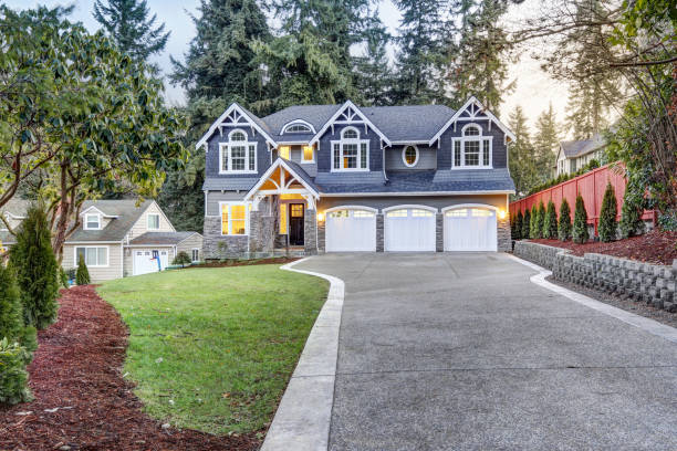 istock Luxurious blue home with three attached garage spaces 874372200