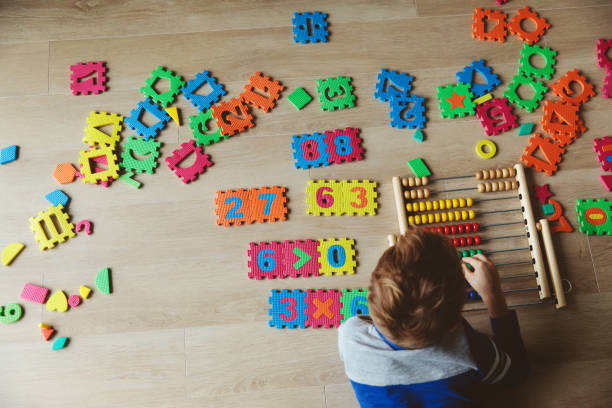 istock little boy learn to calculate numbers 874372494