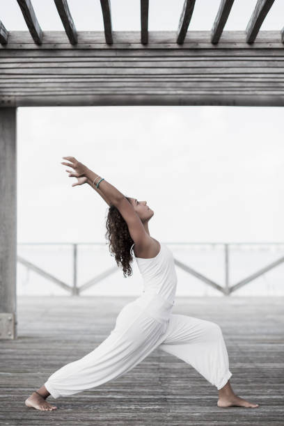 istock Yoga warrior pose virabhadrasana 874373748