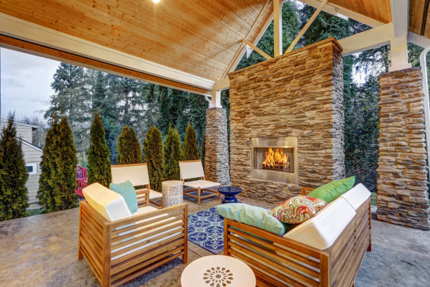 Chic covered back patio with built in gas fireplace stock photo