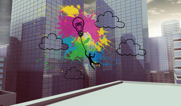 istock Colourful light bulb graphic on city view 874376746