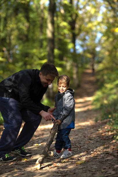 istock Father and son playing in the forest 874379780