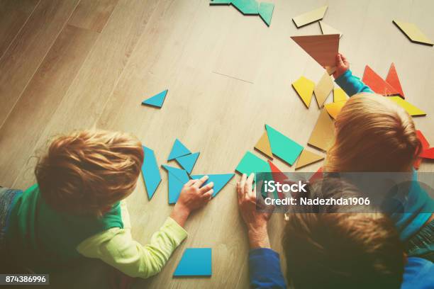 Teacher And Kids Playing With Geometric Shapes Stock Photo - Download Image Now - Morning, Childhood, Child