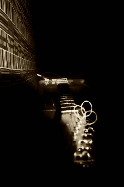 istock Electric Guitar Resting On Amplifire In Music Studio 874388026