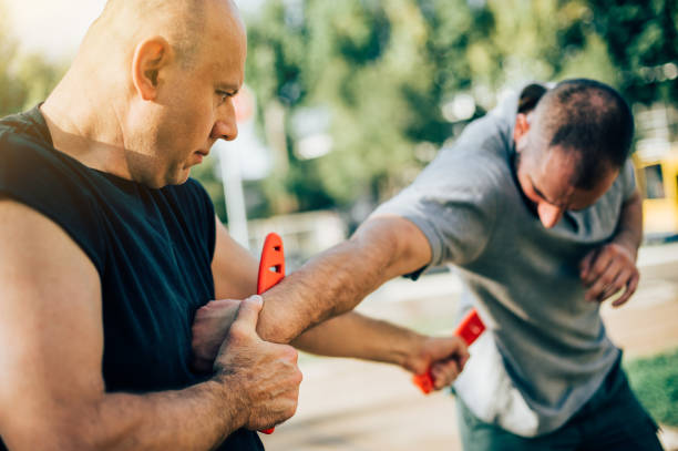 istock Knife vs knife. Kapap instructor demonstrates fighting and disarming technique 874391504