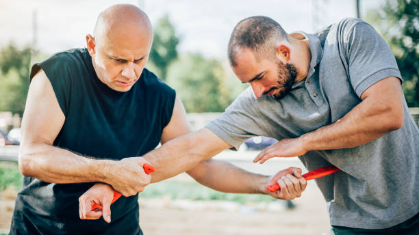istock Knife vs knife. Kapap instructor demonstrates fighting and disarming technique 874394458