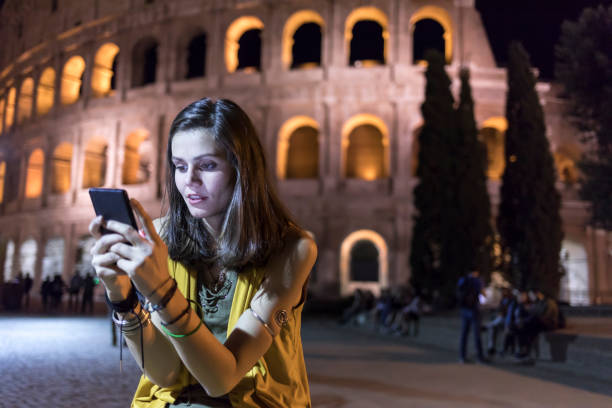 istock Worried young woman using smart phone at night 874395702